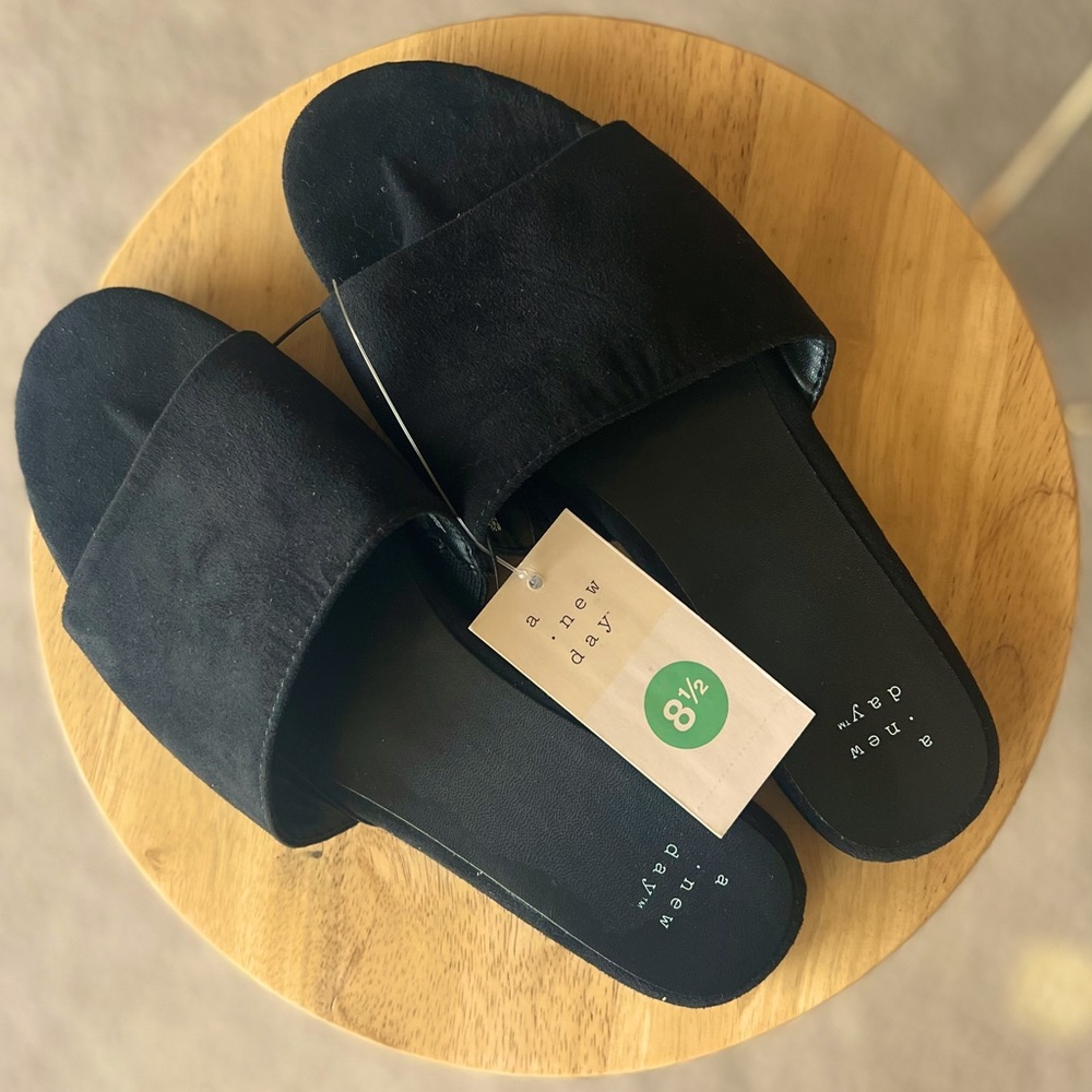 Brand new “A New Day” slippers. Size 8.5. Still in box. Comfortable and trendy